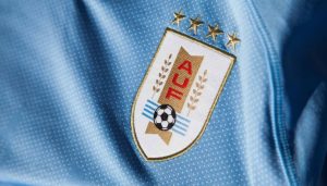 Why does the Uruguayan national football team have stars in their badge